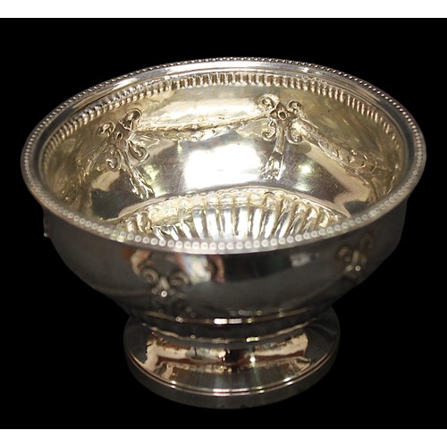 313 - A George III small silver bowl, with beaded rim, relief moulded swags to side and raised on circular... 