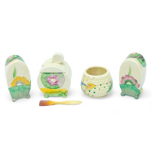 273 - A four-piece Clarice Cliff Bizarre pattern cruet set, comprising salt and pepper shakers and preserv... 