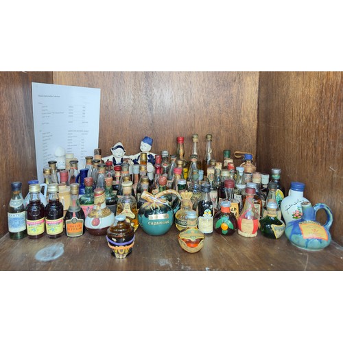 226 - A collection of one-hundred thirty-five bottles of alcohol miniatures, sealed and some partially eva... 