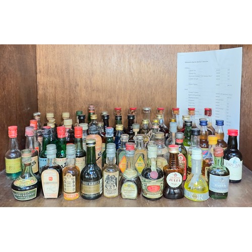 226 - A collection of one-hundred thirty-five bottles of alcohol miniatures, sealed and some partially eva... 