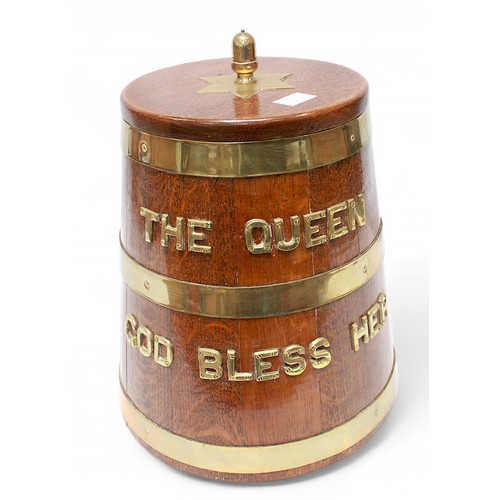 21 - A brass-bound oak Naval 'style' rum barrel mounted with brass letters 'The Queen God Bless Her,'  34... 