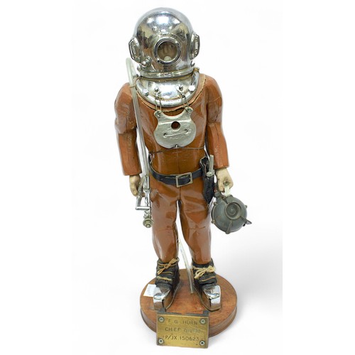 24 - A scratch-built carved and painted wooden and stainless-steel figure of a Deep Sea Diver, presented ... 