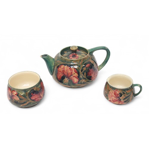 275 - A William Moorcroft pottery three-piece bachelors tea set, in the ‘Spanish’ pattern, comprising teap... 