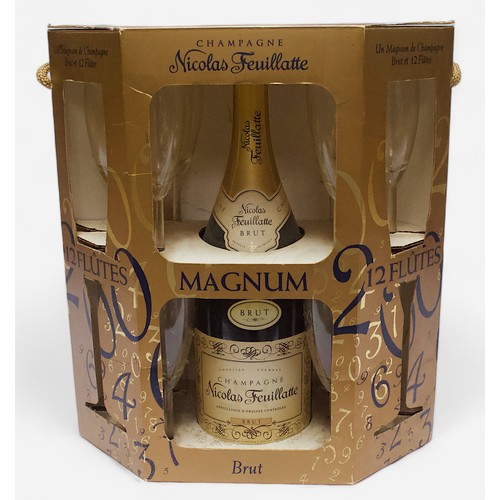 244 - A commemorative Millennium magnum bottle of Nicolas Feuillatte champagne, with a set of 12 flutes, e... 