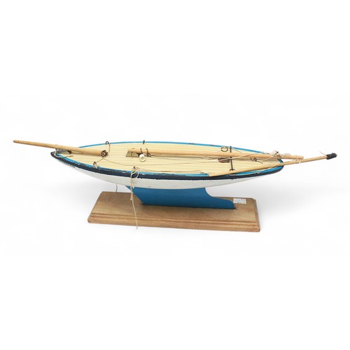 45 - A 'Star Yacht' model pond yacht, solid wooden hull with pen-lined deck and metal keel, without sails... 