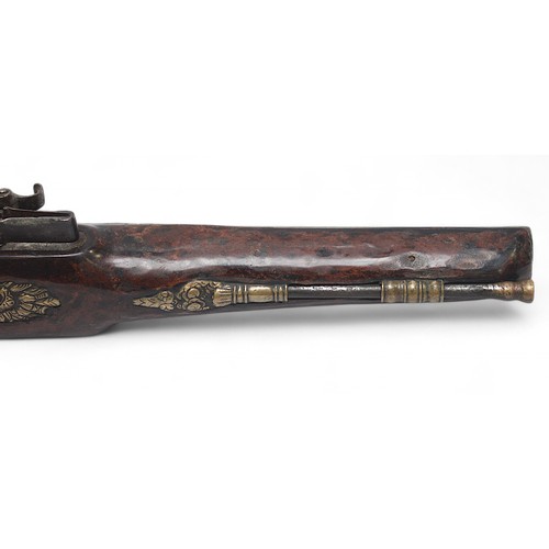 126 - An ornate 18th century flintlock pistol, possibly Irish, the 22cm steel barrel and lock cast with tr... 