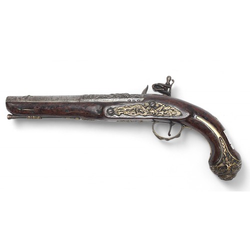 126 - An ornate 18th century flintlock pistol, possibly Irish, the 22cm steel barrel and lock cast with tr... 