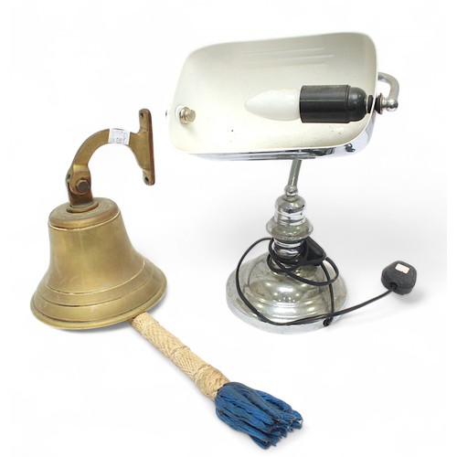 54 - A brass bell with rope-spliced clacker and wall bracket, 28cm high from base of bell to top of brack... 