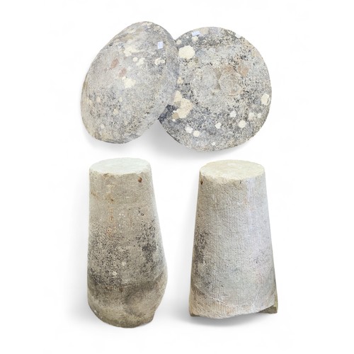 542 - A pair of stone staddle stones, of typical form, raised on tapering, cylindrical supports, 71cm tall... 