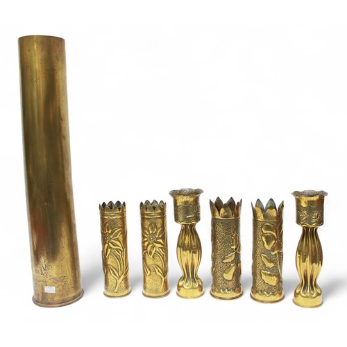 60 - A large WWII 5-inch brass artillery shell, dated 1941, 76cm high, together with three pairs of 'Tren... 