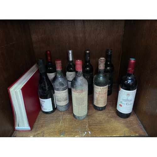 246 - Nine various bottles of wine, including a selection of vintage wines, comprising Cordier Chateau Tal... 