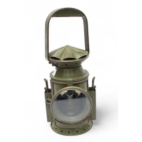 75 - A British Army Railway lamp with original green paint and broad arrow stamp, together with a set of ... 