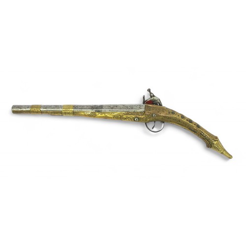 136 - A 19th century Balkan Miquelet flintlock pistol the full stock and rat tail butt clad with engraved ... 