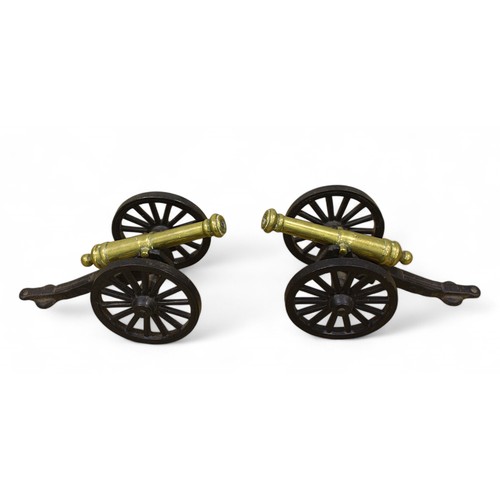 8 - A pair of miniature cast iron and brass desk canons, approx. 9.5cm tall