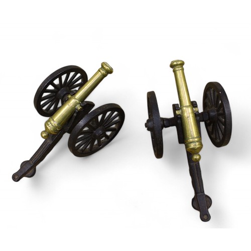 8 - A pair of miniature cast iron and brass desk canons, approx. 9.5cm tall