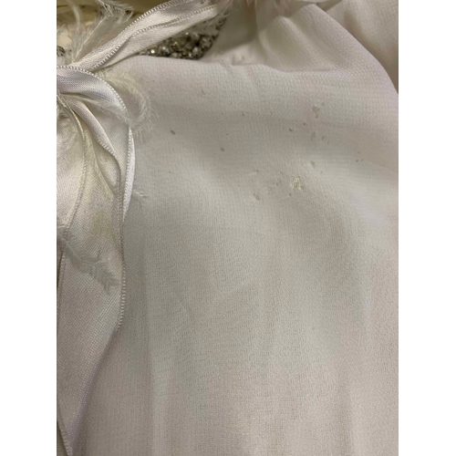 111 - Stage Wear / Evening Wear: Three garments, 
c. 1970s, 
including: a white maxi dress, of floral net ... 