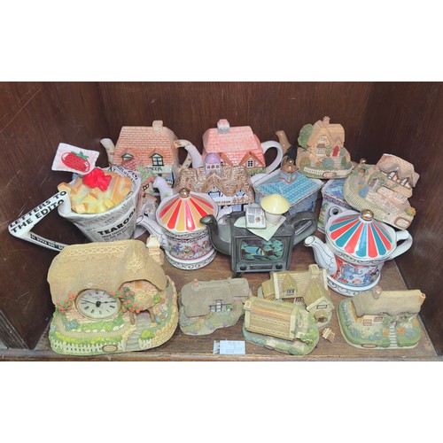 10 - A collection of eleven assorted ceramic novelty teapots, including examples by Sadler etc. together ... 