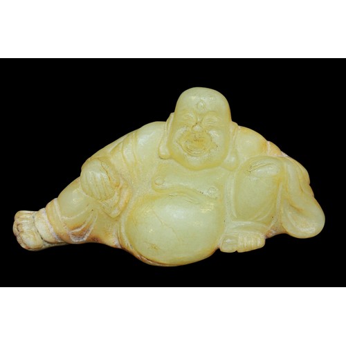 150 - A Chinese carved jade figure of Budai, typically modelled seated with fat belly, symbol of abundance... 