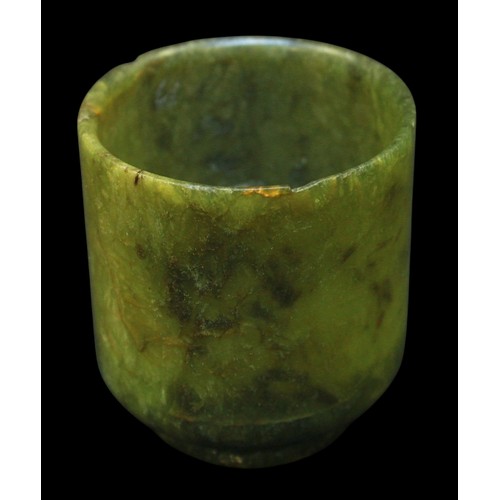 152 - A Chinese Qing Dynasty Nephrite Spinach Jade turned cup, raised on diminished circular foot, (rim ch... 