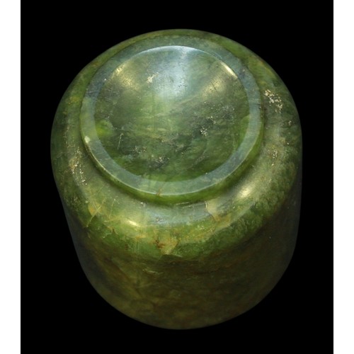 152 - A Chinese Qing Dynasty Nephrite Spinach Jade turned cup, raised on diminished circular foot, (rim ch... 