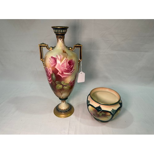 22 - A Royal Worcester twin-handled pedestal vase, 1908, painted with Hadley roses to cream ground, shape... 