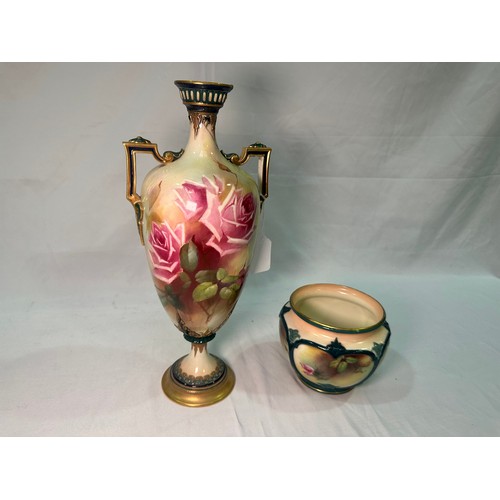 22 - A Royal Worcester twin-handled pedestal vase, 1908, painted with Hadley roses to cream ground, shape... 