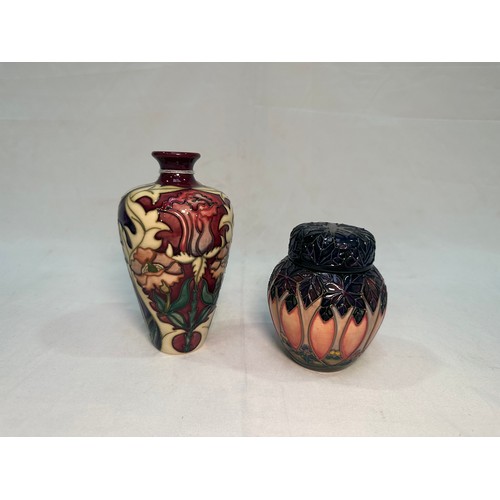 54 - A Moorcroft Pottery ‘Masquerade’ pattern vases and, dated 2002, designed by Rachel Bishop, 16cm, tog... 