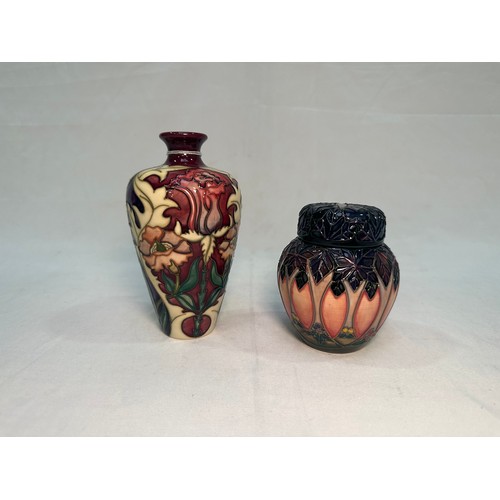 54 - A Moorcroft Pottery ‘Masquerade’ pattern vases and, dated 2002, designed by Rachel Bishop, 16cm, tog... 