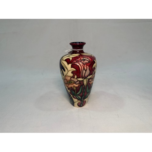 54 - A Moorcroft Pottery ‘Masquerade’ pattern vases and, dated 2002, designed by Rachel Bishop, 16cm, tog... 