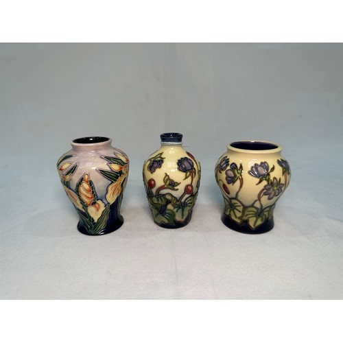 53 - Two Moorcroft Pottery ‘Hepatica’ pattern vases, dated 2000 and 2002, designed by Emma Bossons, toget... 