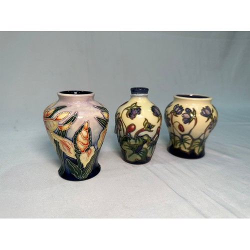 53 - Two Moorcroft Pottery ‘Hepatica’ pattern vases, dated 2000 and 2002, designed by Emma Bossons, toget... 