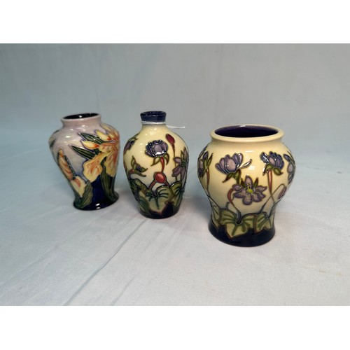 53 - Two Moorcroft Pottery ‘Hepatica’ pattern vases, dated 2000 and 2002, designed by Emma Bossons, toget... 