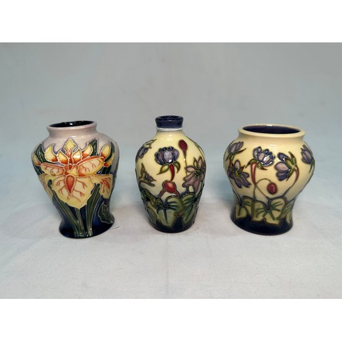 53 - Two Moorcroft Pottery ‘Hepatica’ pattern vases, dated 2000 and 2002, designed by Emma Bossons, toget... 