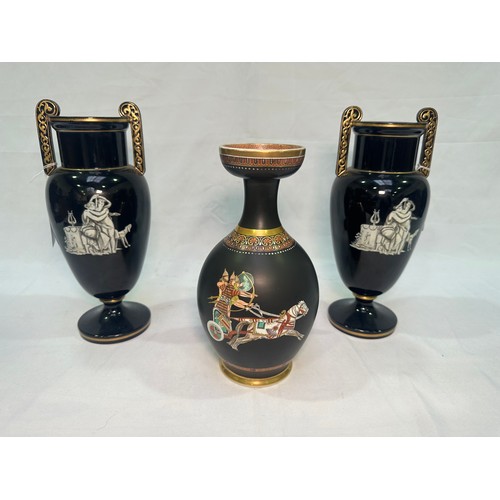 67 - A pair of late 19th Century glazed terracotta amphora vases, black glaze and decorated with neo-clas... 