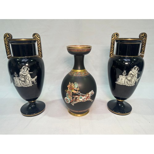 67 - A pair of late 19th Century glazed terracotta amphora vases, black glaze and decorated with neo-clas... 