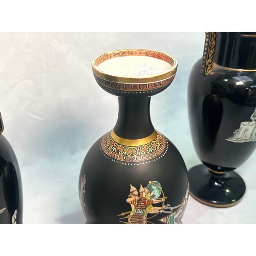 67 - A pair of late 19th Century glazed terracotta amphora vases, black glaze and decorated with neo-clas... 