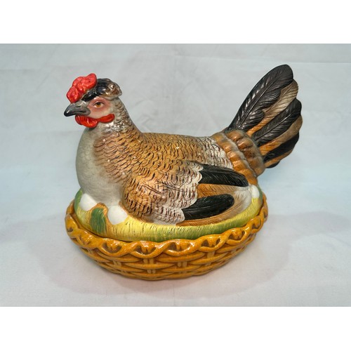 69 - A late 19th century Staffordshire Pottery egg basket modelled as a hand-painted hen on its glazed wi... 