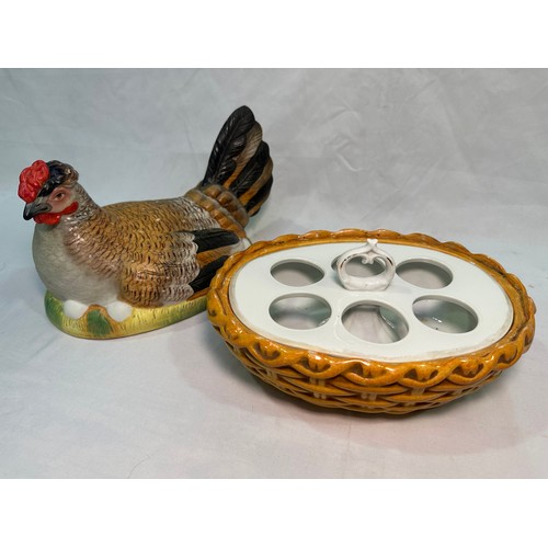 69 - A late 19th century Staffordshire Pottery egg basket modelled as a hand-painted hen on its glazed wi... 