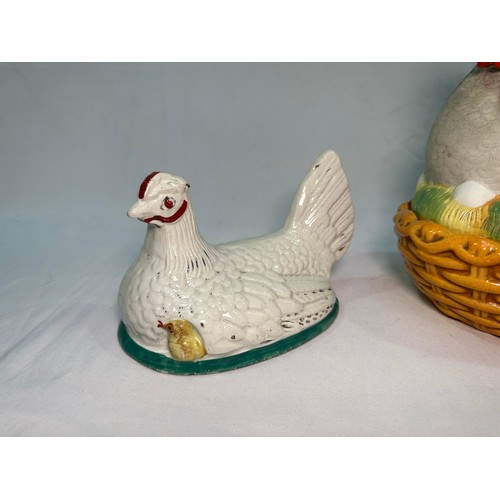 69 - A late 19th century Staffordshire Pottery egg basket modelled as a hand-painted hen on its glazed wi... 