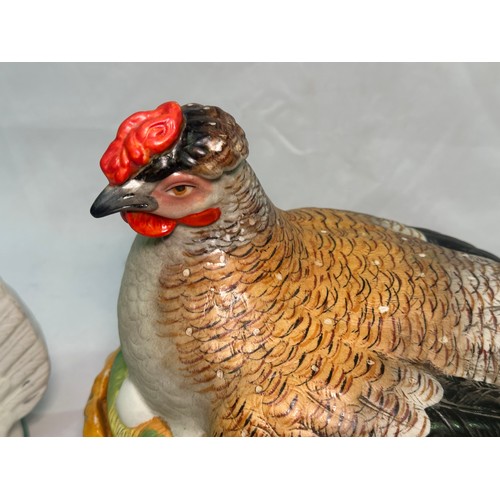 69 - A late 19th century Staffordshire Pottery egg basket modelled as a hand-painted hen on its glazed wi... 