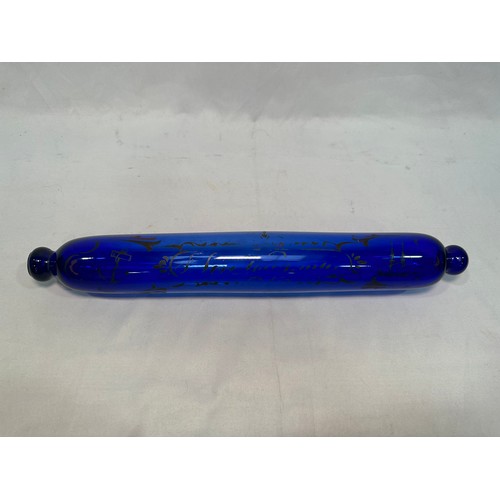 73 - A Bristol blue glass rolling pin printed with text, ships and anchor, 37cm, together with a Bristol ... 