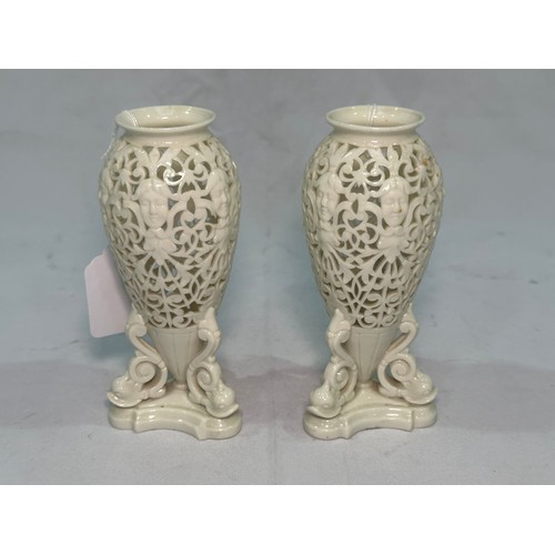 68 - A pair of Royal Worcester Grainger & Co Worcester reticulated vases, pierced in a scrolled pattern a... 