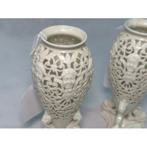 68 - A pair of Royal Worcester Grainger & Co Worcester reticulated vases, pierced in a scrolled pattern a... 