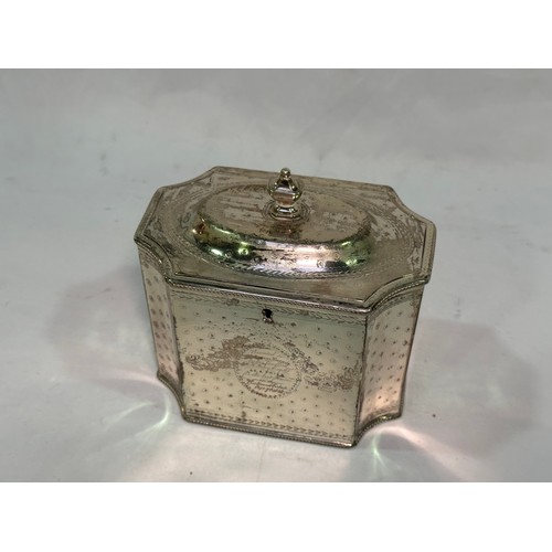 172 - A George III silver tea caddy by Henry Green, of square form with concave corners, a continuous etch... 