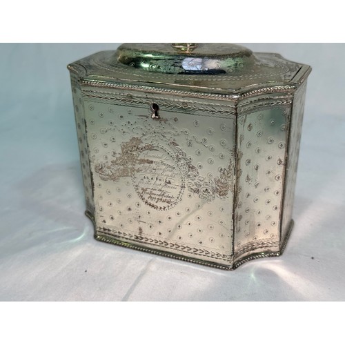 172 - A George III silver tea caddy by Henry Green, of square form with concave corners, a continuous etch... 