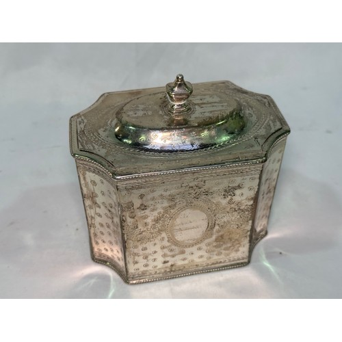 172 - A George III silver tea caddy by Henry Green, of square form with concave corners, a continuous etch... 