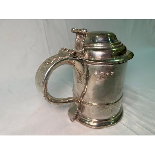 171 - A George I lidded silver tankard by Humphrey Payne, of plain design and with scrolled thumb-piece, r... 