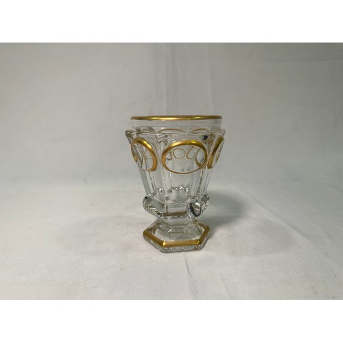 72 - A Baccarat crystal glass goblet, of inverted hexagonal baluster form with gilded decoration, with or... 