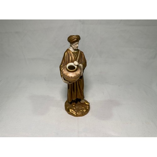 77 - A Royal Worcester figure, after James Hadley, of a Middle Eastern male water carrier, c.1915, dresse... 