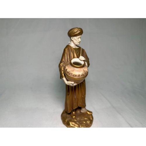 77 - A Royal Worcester figure, after James Hadley, of a Middle Eastern male water carrier, c.1915, dresse... 